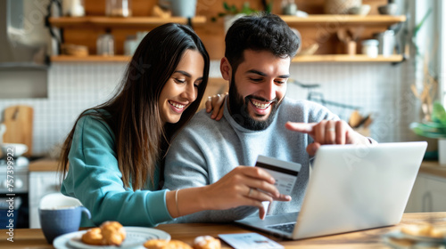 Joyful couple engaged in online shopping