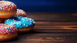 Assorted mouth-watering donuts on blurred background with space for custom text and captions