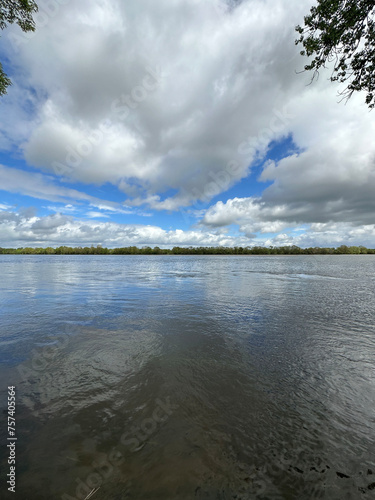 Clouds reflected at Loire river in the Loire valley in France, Europe