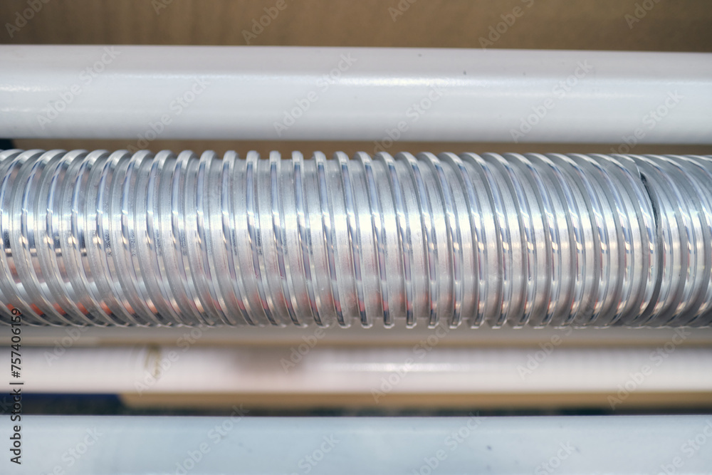Industrial metal air flow and air conditioning pipes on the ceiling of an industrial factory. keeping the air fresh and clean for health and safety purposes. Healthy clean working environment Industrial metal air flow and air conditioning pipes on the ceiling of an industrial factory. keeping the air fresh and clean for health and safety purposes. Healthy clean working environment