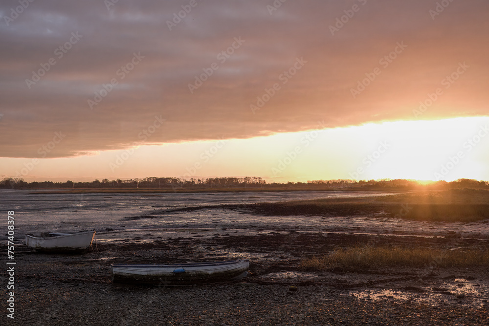row boats on the beach at sunset Emsworth Hampshire England	
