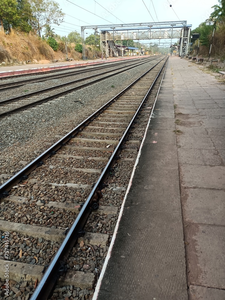 Fototapeta premium A railway track or railroad track, also known as a train track or permanent way, is the structure on a railway or railroad consisting of the rails, fasteners, railroad ties and ballast. 