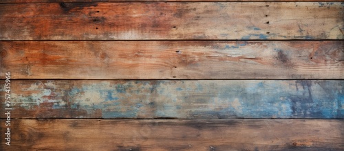 Close up of a brown hardwood wall with numerous stains, showcasing a unique brickwork pattern. The wood stain adds character to the building material