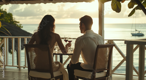 Silhouette of a beautiful couple on a date in a cafe by the ocean, a beautiful sunset on the coast, advertising a hotel for a vacation, an invitation to a cruise to the Caribbean islands