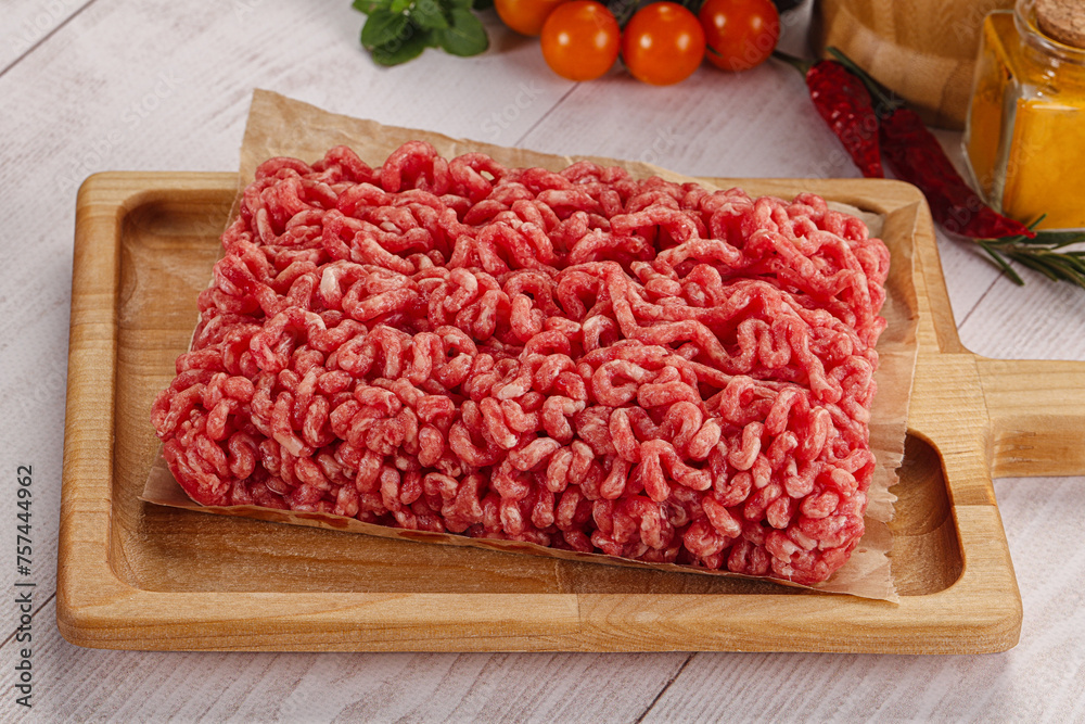 Raw minced beef meat over board Raw minced beef meat over board