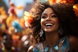 Happy woman with curly hairstyle and flower in her hair is smiling