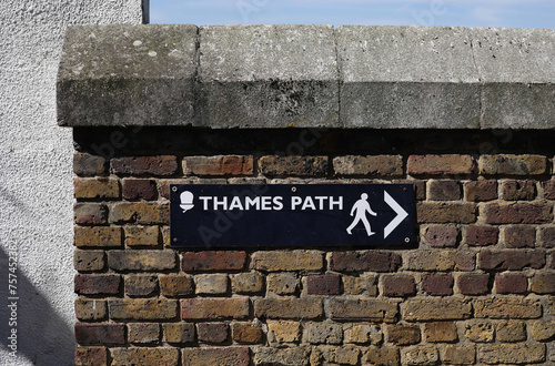 Thames Path sign on a brick wall on the Isle of Dogs photo