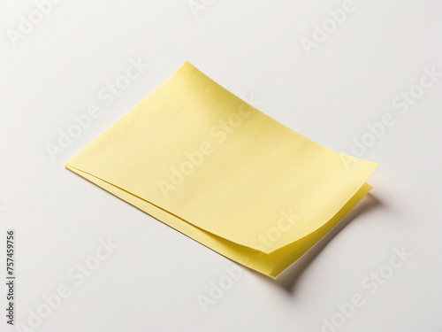 A yellow sticky note placed on a white background.