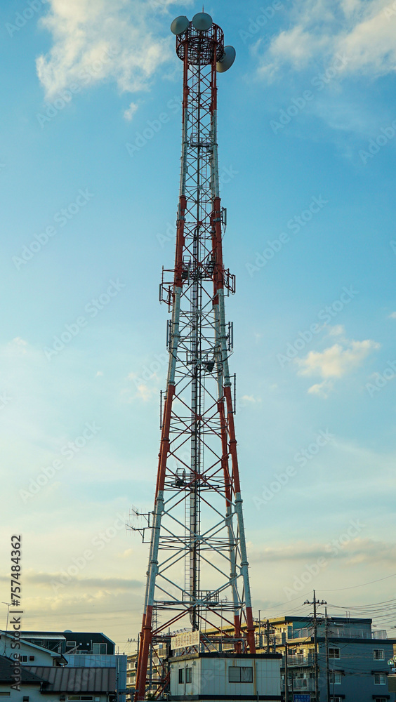 A huge transmission tower in the middle of downtown Japan