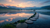A tranquil lake reflects the beauty of wind turbines and stepping stones at dawn's early light. Innovative solutions to address climate change, such as renewable energy technologies
