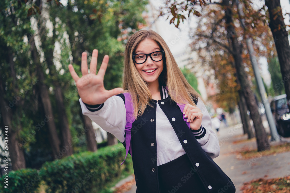 Photo portrait of charming teen woman schoolgirl excited wave hand say hello dressed stylish uniform clothes nature green park background Photo portrait of charming teen woman schoolgirl excited wave hand say hello dressed stylish uniform clothes nature green park background