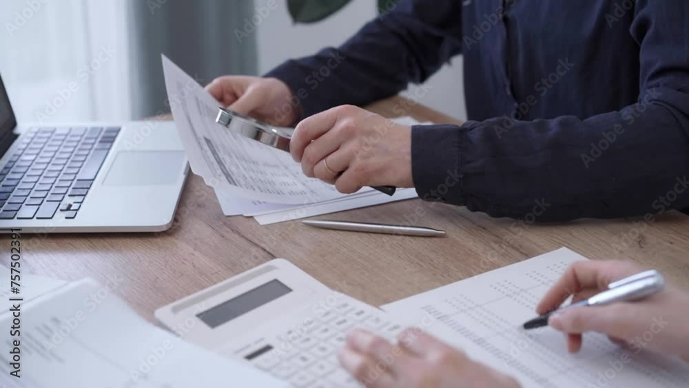 Business professionals analyzing financial documents. Bookkeeping, finance, audit and taxes. Business concept Business professionals analyzing financial documents. Bookkeeping, finance, audit and taxes. Business concept
