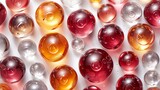 a close up of a bunch of different colored balls on a white surface with drops of water on the surface.