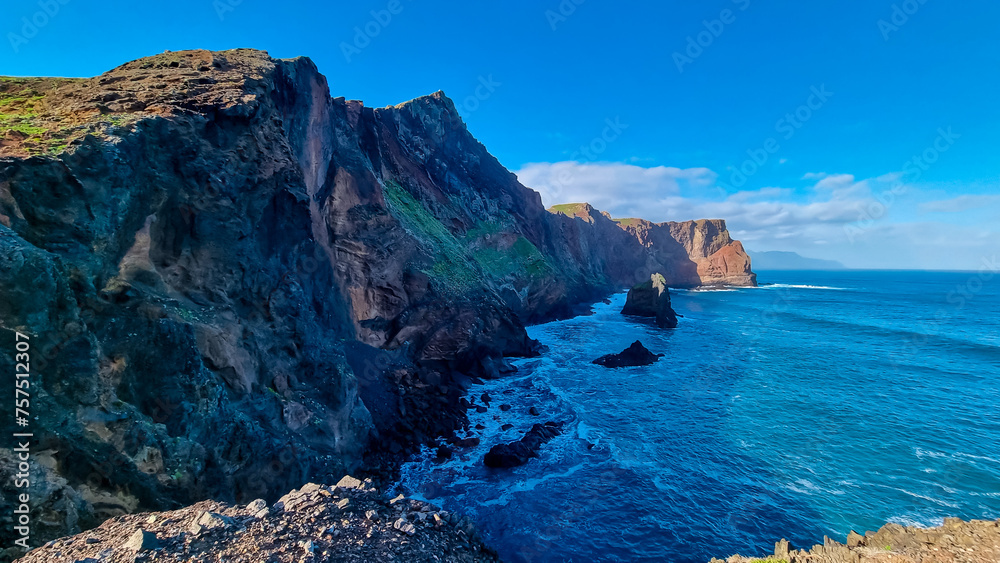 Panoramic view of majestic Atlantic Ocean coastline at Ponta de Sao Lourenco peninsula, Canical, Madeira island, Portugal, Europe. Coastal hiking trail along steep rocky rugged cliffs. Sea breeze. Awe Panoramic view of majestic Atlantic Ocean coastline at Ponta de Sao Lourenco peninsula, Canical, Madeira island, Portugal, Europe. Coastal hiking trail along steep rocky rugged cliffs. Sea breeze. Awe