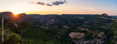 Golden Sunset Over Mountain Landscape. Serene beauty of nature with stunning sunset view over a mountain with the warm hues illuminating the rugged peaks, Alto Tajo Natural Park, Guadalajara, Spain © JMDuran Photography