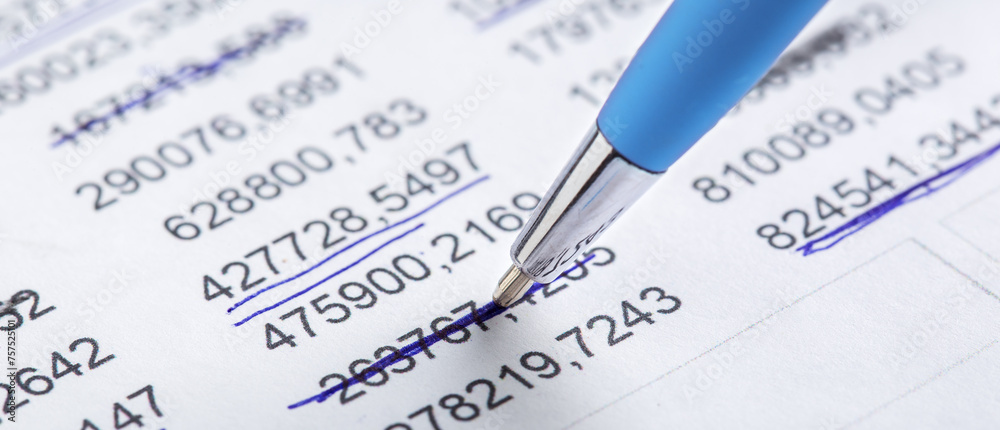 Accounting document with pen, money, coins and checking financial chart. Concept of banking, financial report and financial audit. Accounting document with pen, money, coins and checking financial chart. Concept of banking, financial report and financial audit.