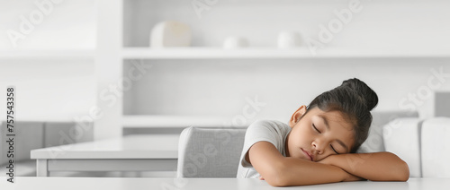 Young Girl Resting on Arms at a Clean Modern Table Setting. Tired after school. Banner with copy space