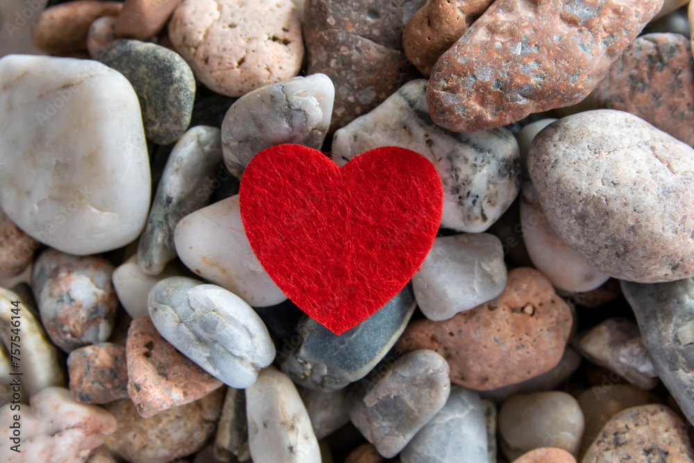 Red heart on the river pebble stones. Red heart on the river pebble stones.