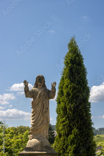 Statue of Jesus on a grave, Dlouhomilov, Czechia