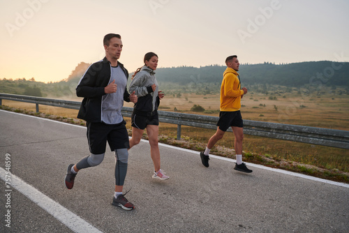 Running towards a common goal, a group of colleagues braves the misty morning air, their determination evident in every stride.