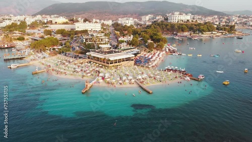 Amazing peninsula adorned with elegant hotels and beaches of azure Ionic sea of Ksamil beach Albania photo