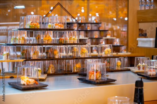 Wallpaper Mural Japanese cuisine, modern restaurant with sushi, sashimi, other Japanese dishes served on moving belt across restaurant, self-service lunch cafe Torontodigital.ca