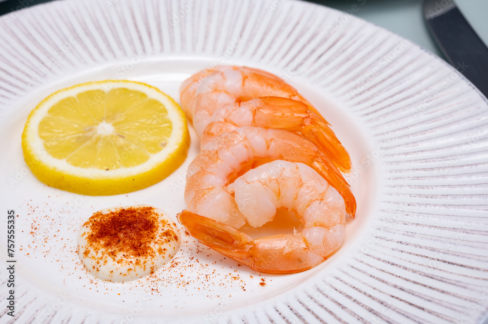 Catch of the day, fresh cooked shrimps served with lemon and garlic sauce in seafood restaurant Catch of the day, fresh cooked shrimps served with lemon and garlic sauce in seafood restaurant