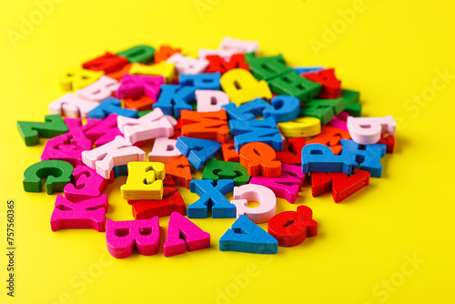 colored letters of the alphabet on a yellow background