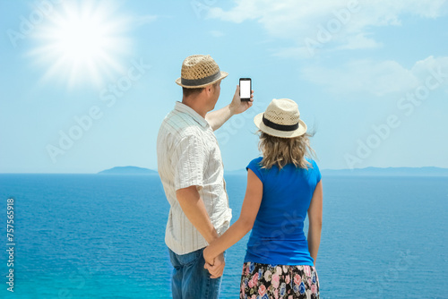 A happy couple selfie at sea on travel