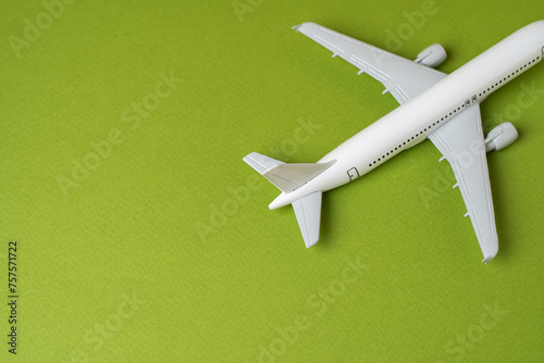 Airlines plane on a green background. Planning your trips. Additional service at airports. Arrival and departure. Business and tourism. Airline. Booking flight tickets. Ecology and success concept.