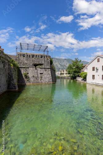 View of river Scurda and stone City Walls with Bembo Bastion, Kotor, Montenegro photo