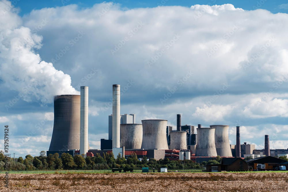 Cooling towers of a nuclear power plant on the background of a cloudy sky Cooling towers of a nuclear power plant on the background of a cloudy sky