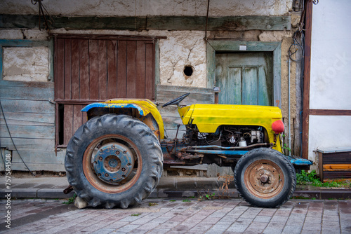 yellow rusty vintage tractor