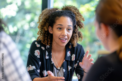 Young female professional actively participates in a business meeting