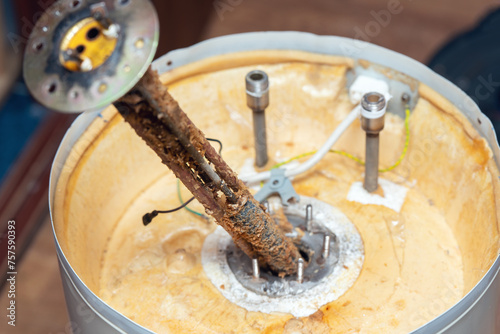 The water heating element of the boiler is covered with sediment and limescale. Boiler repair and maintenance
