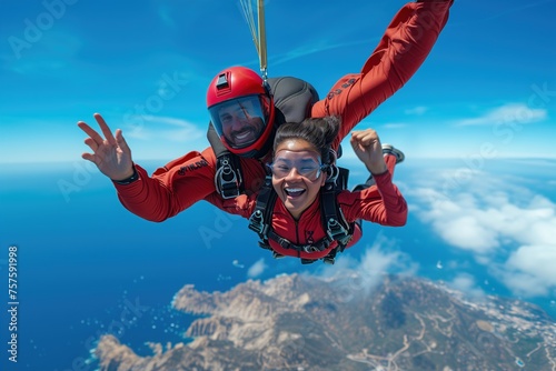 Exhilarating image of tandem skydivers in red suits flying high above a scenic coastline