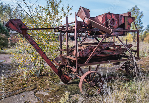 Old thrashing machine in kolkhoz in Korohod village in Chernobyl Exclusion Zone, Ukraine