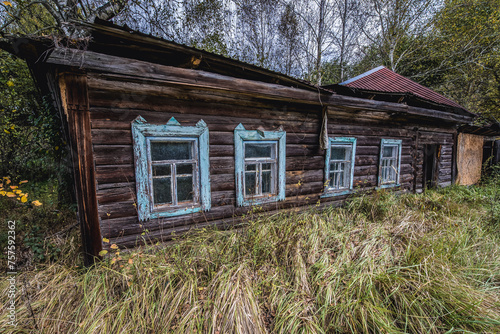 Wooden cottage in abandoned Stechanka village in Chernobyl Exclusion Zone  Ukraine