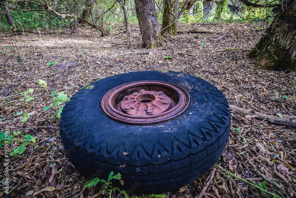 Old tyre in abandoned Stechanka village in Chernobyl Exclusion Zone, Ukraine Old tyre in abandoned Stechanka village in Chernobyl Exclusion Zone, Ukraine