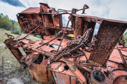 Combine harvester wrecking yard near Illinci village in Chernobyl Exclusion Zone in Ukraine