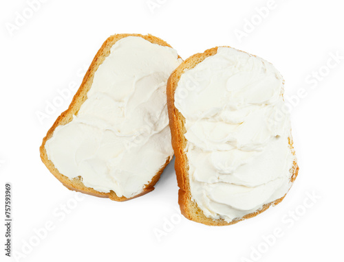 Slices of bread with cream cheese isolated on white, top view