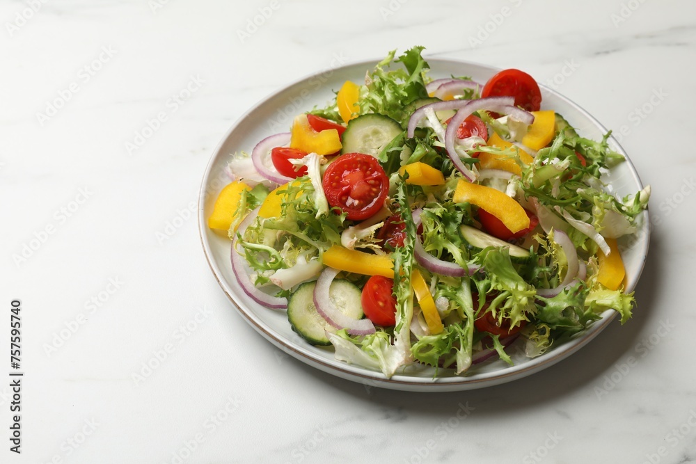 Tasty fresh vegetarian salad on white marble table, space for text