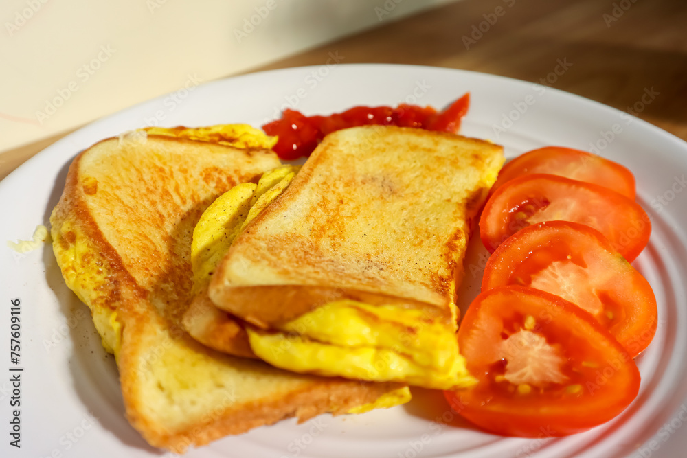 Simple breakfast menu, bread toast with egg and tomato Simple breakfast menu, bread toast with egg and tomato