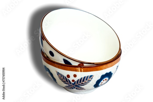 Empty ceramic bowl with motif, isolated in white background photo