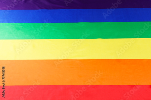 Rainbow LGBT flag as background, top view