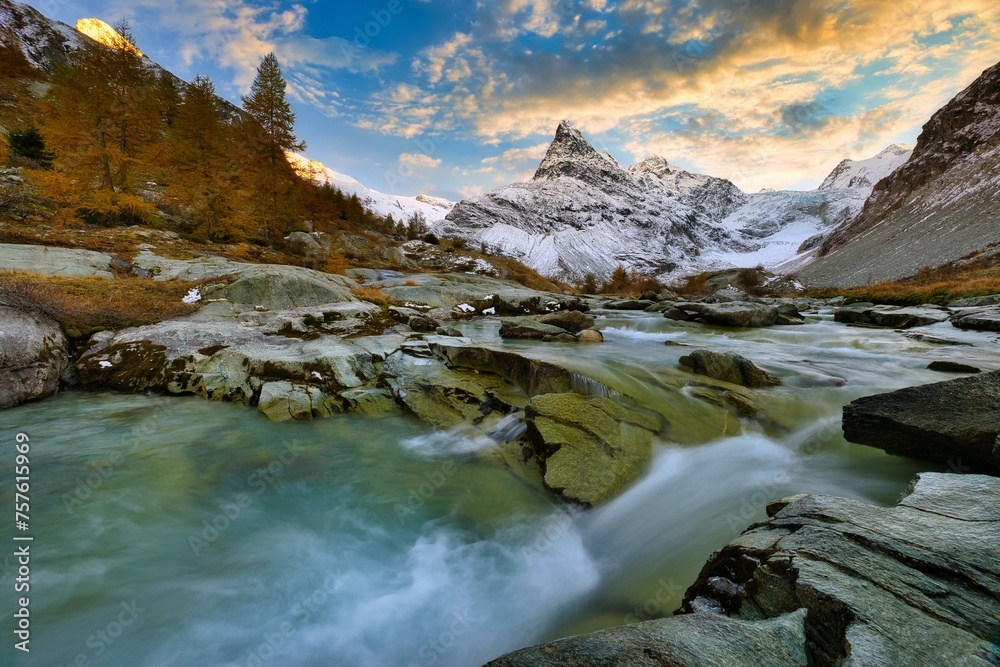 Evening mood at the brook near Ferpecle, behind it snowy Mont Mine, Val d'Herens, Canton Valais, Switzerland, Europe Evening mood at the brook near Ferpecle, behind it snowy Mont Mine, Val d'Herens, Canton Valais, Switzerland, Europe