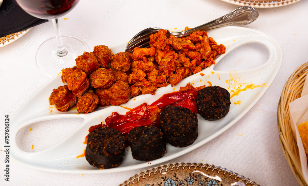 Φωτογραφία Tasty hot spanish snack from blood sausage with chorizo, picadillo and roasted p