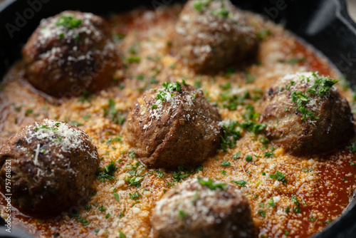 italian meat balls with tomato sauce and cheese