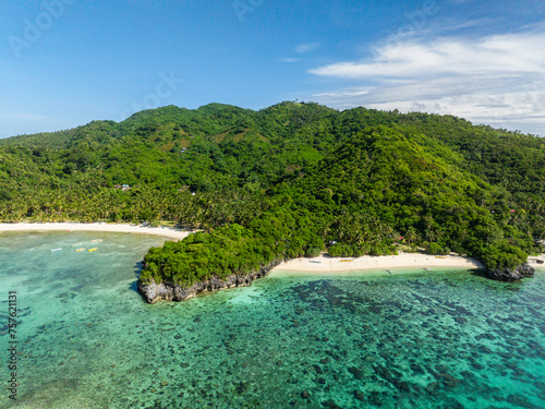 Fototapeta Naklejka Na Ścianę i Meble -  Cobrador Island with green trees and white sand beach. Romblon, Philippines.
