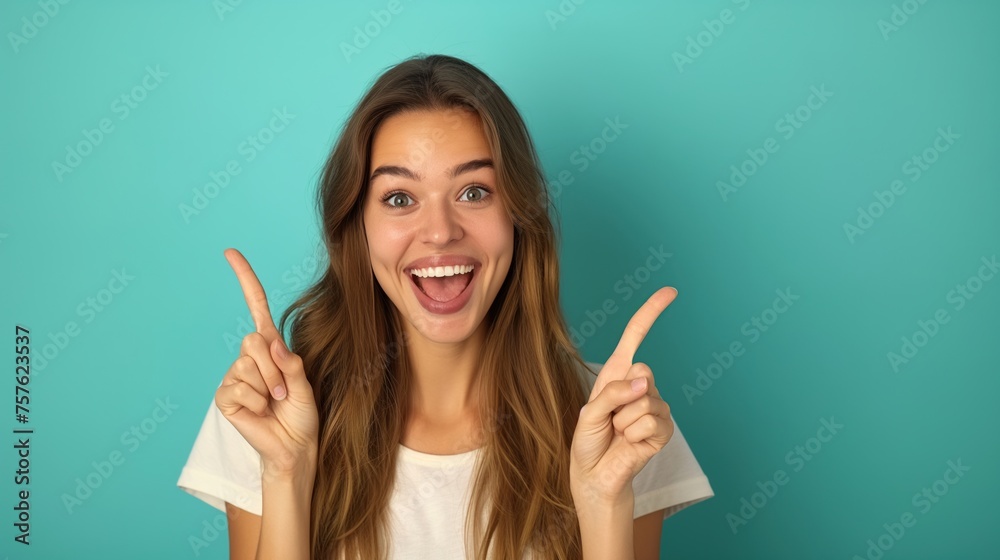 oung woman isolated on blue background pointing to a copy space, expressing excitement and desire oung woman isolated on blue background pointing to a copy space, expressing excitement and desire